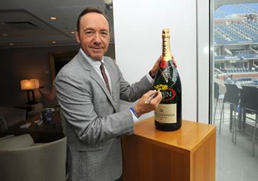 Kevin Spacey signed a Moet & Chandon Imperial bottle for charity at the 2013 US Open.