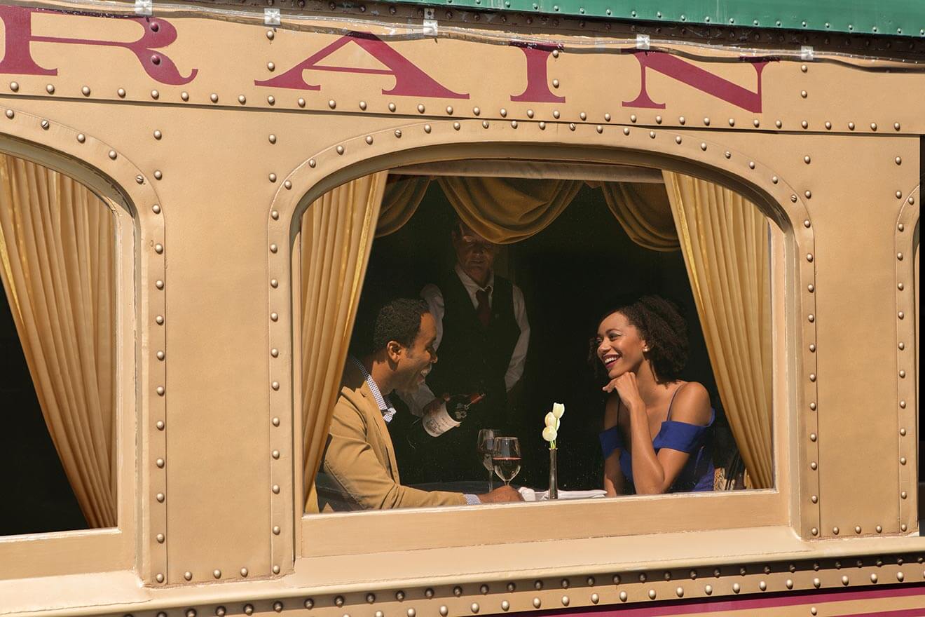 Nappa Valley Wine Train, couple enjoying a window seat and glass of wine
