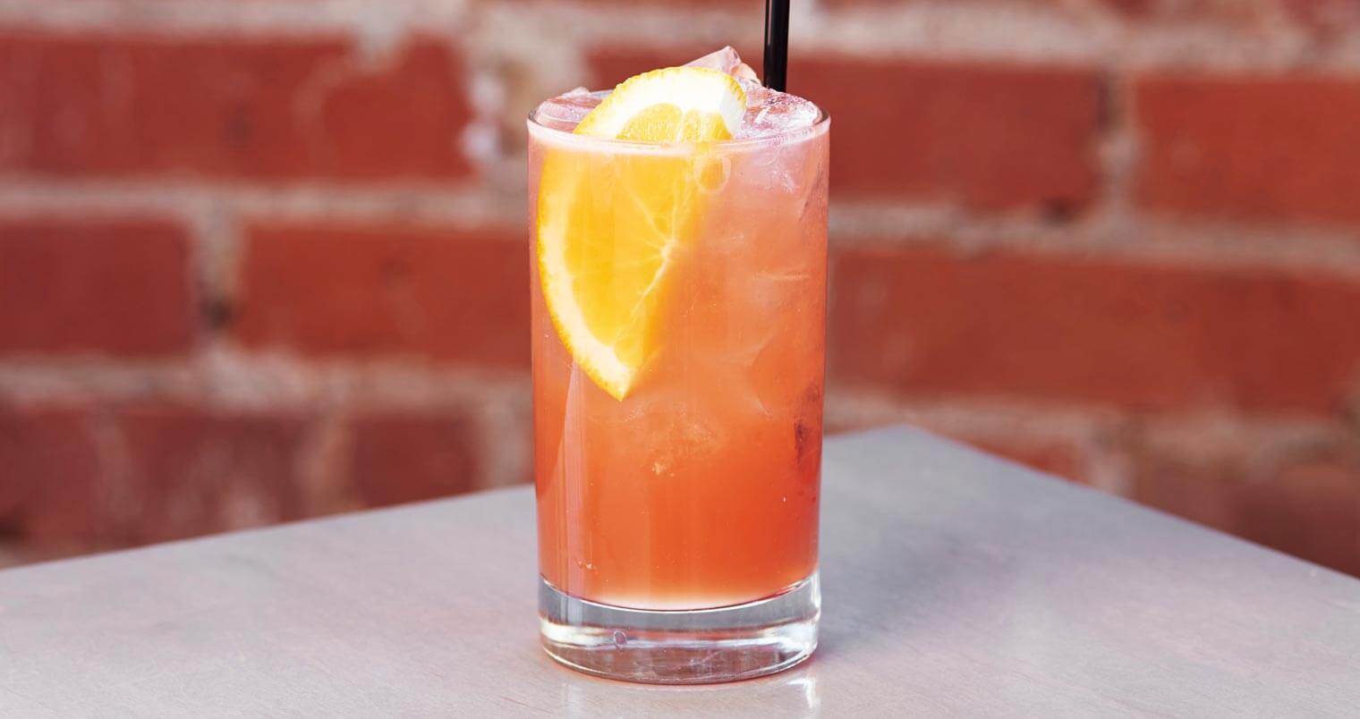#1 Crush, cocktail with garnish, brick wall, featured image