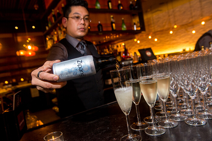 KOA bartenders served up Zipang sparkling sake as the welcome drink for Sake: Unfiltered