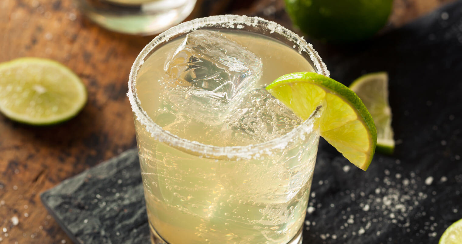 The Classic Margarita, cocktail with salt rim and lime wedge, featured image