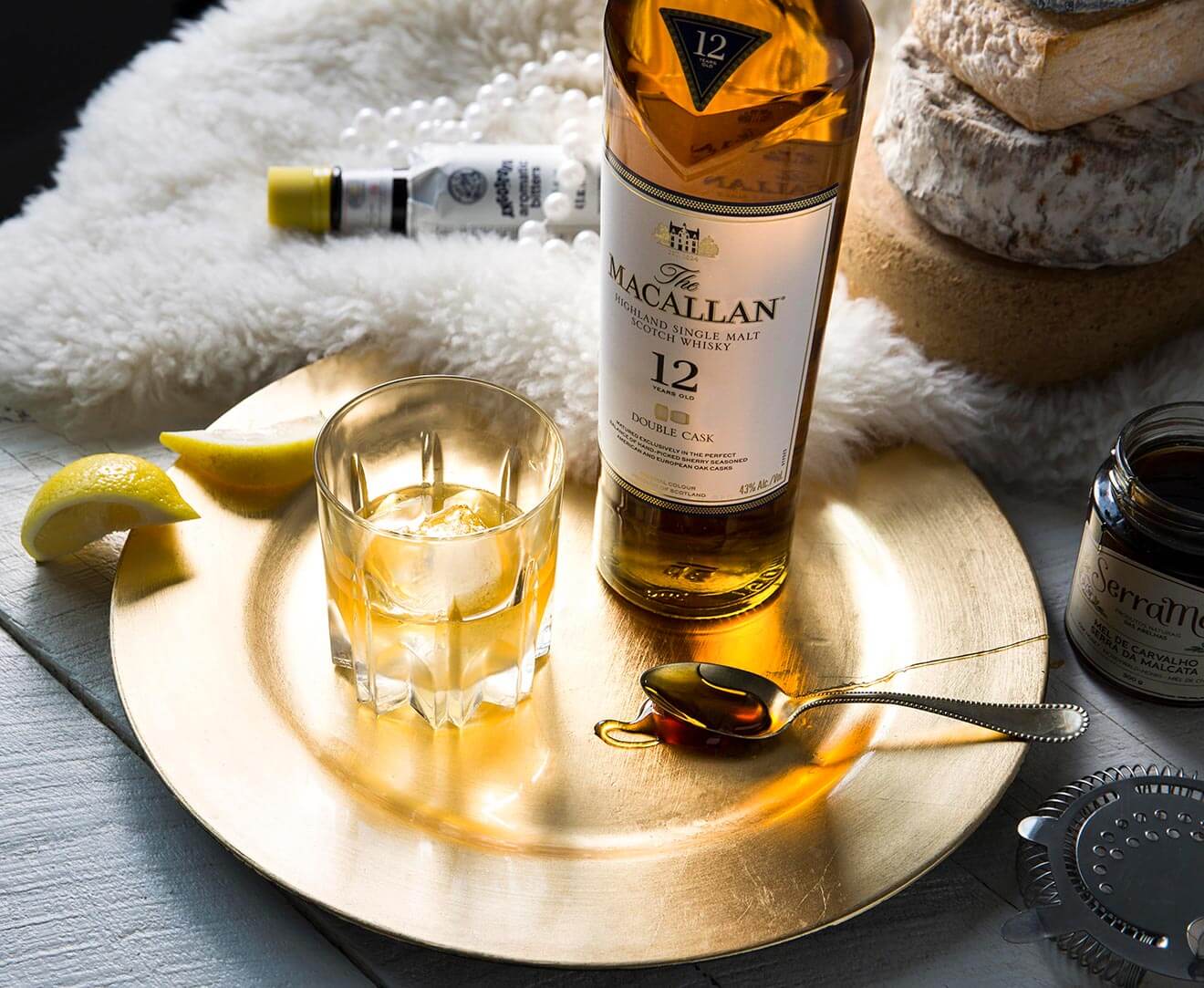 The Honeypot, cocktail, bottle and garnish on plate