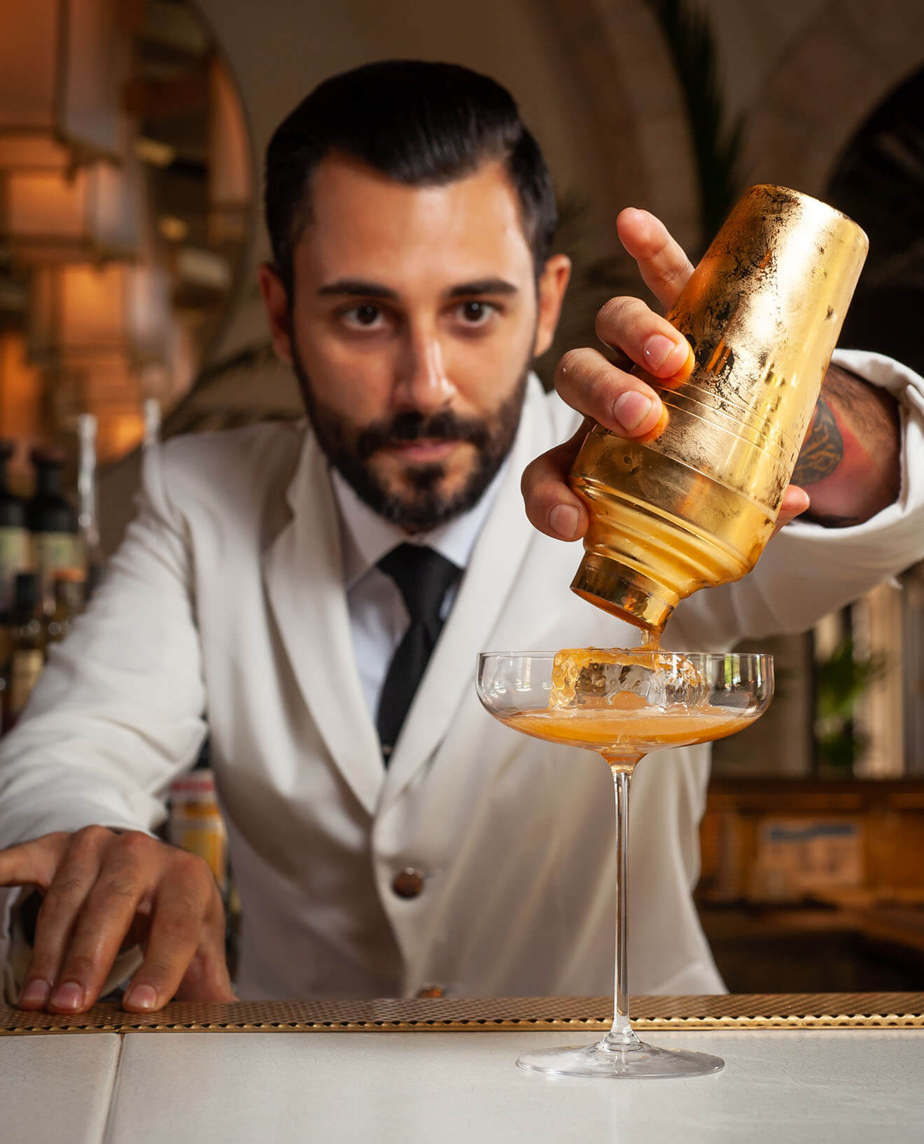 Valentino Longo Pouring a Cocktail